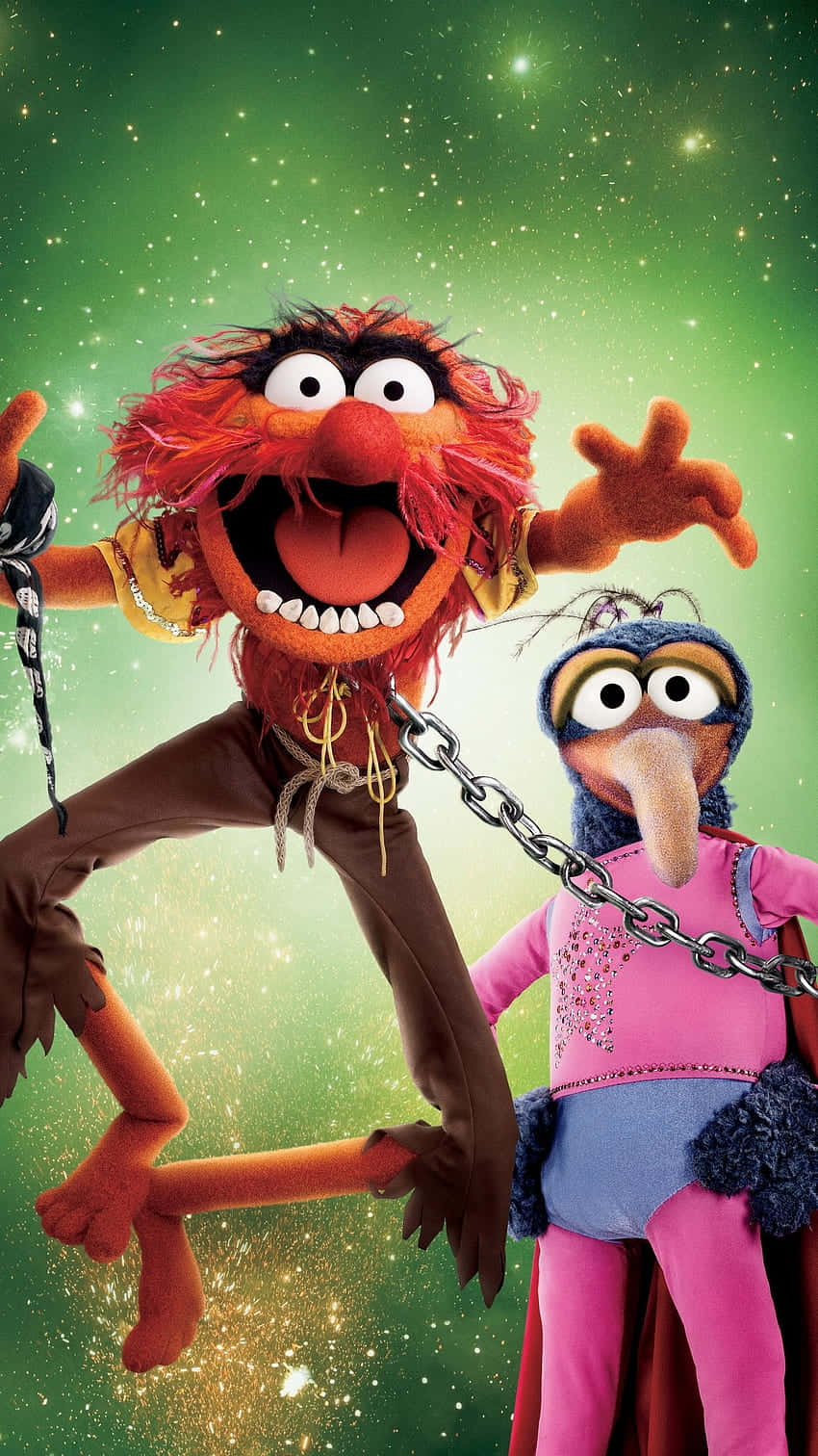  壁紙 — 兩個Muppet角色在閃爍的綠色星空背景下歡快地跳舞。
