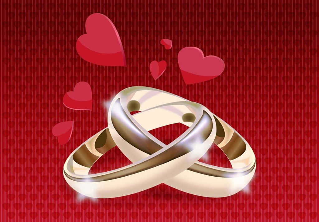 Marriage 桌布 壁紙 — 兩個交錯的金色結婚戒指在紅色心形圖案背景上閃耀，並有漂浮的心形。