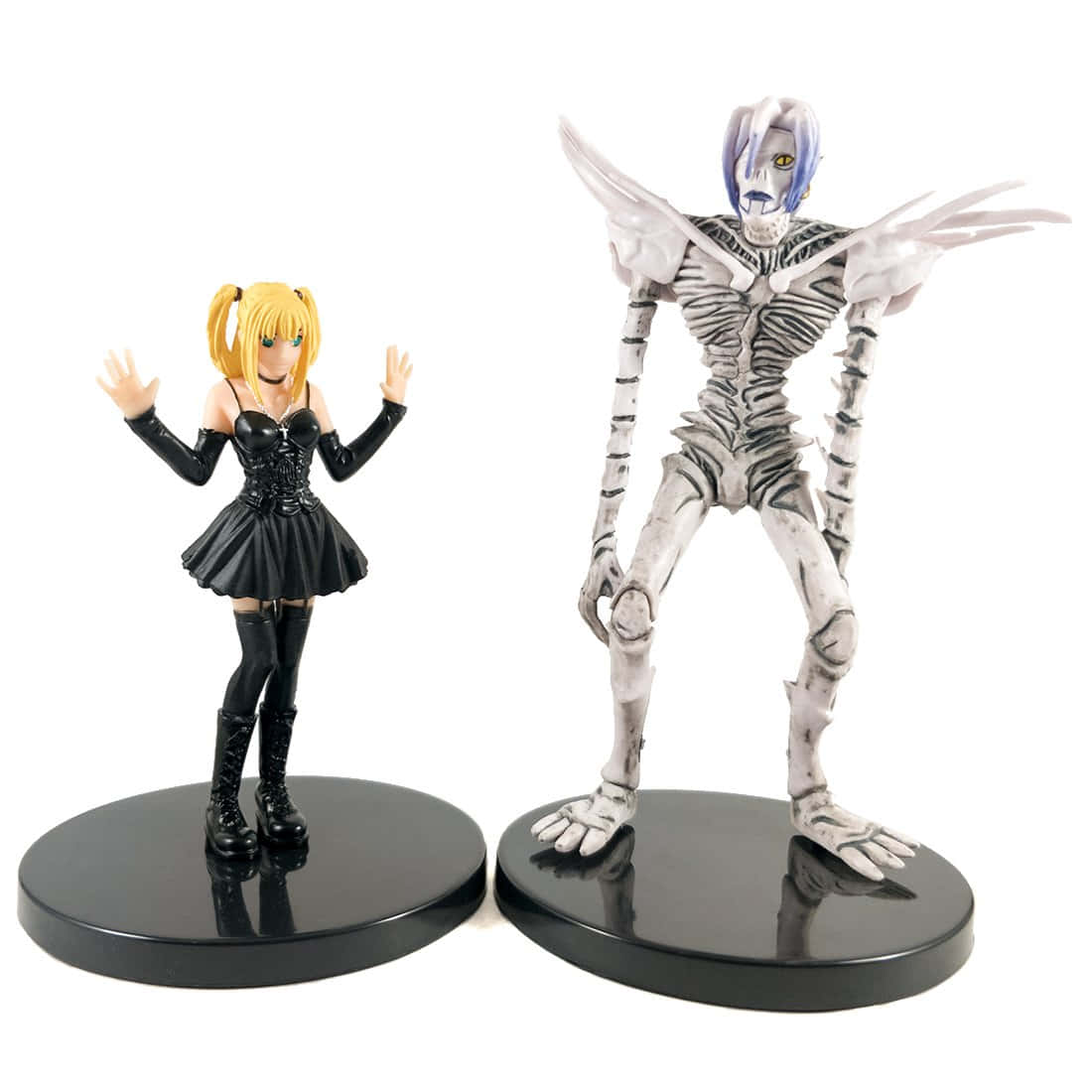 Death Note Rem 桌布 壁紙 — 兩個動漫人偶並排站立，一個是金髮女孩穿著黑色服裝，另一個是帶翅膀的骷髏天使。