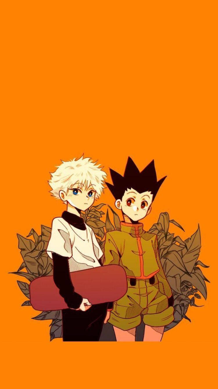 Gon And Killua 桌布 壁紙 — 兩個動漫男孩，頭髮豎起，站在純橙色背景前，周圍有棕色樹葉。