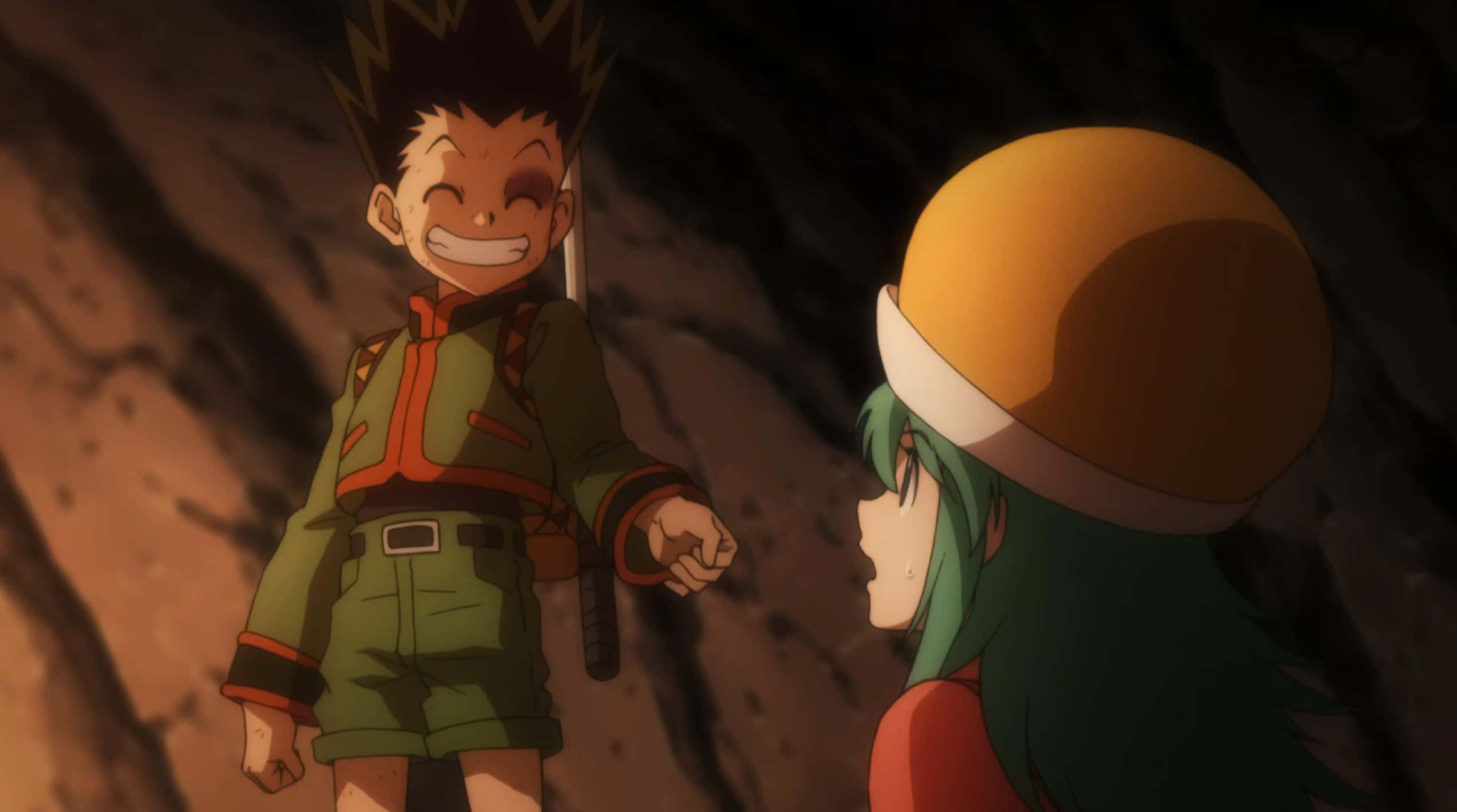 Hunter X Hunter Ponzu 桌布 壁紙 — 兩個動漫角色在昏暗的洞穴中，一個咧嘴大笑拿著劍，另一個綠色頭髮戴橙色帽子看著。