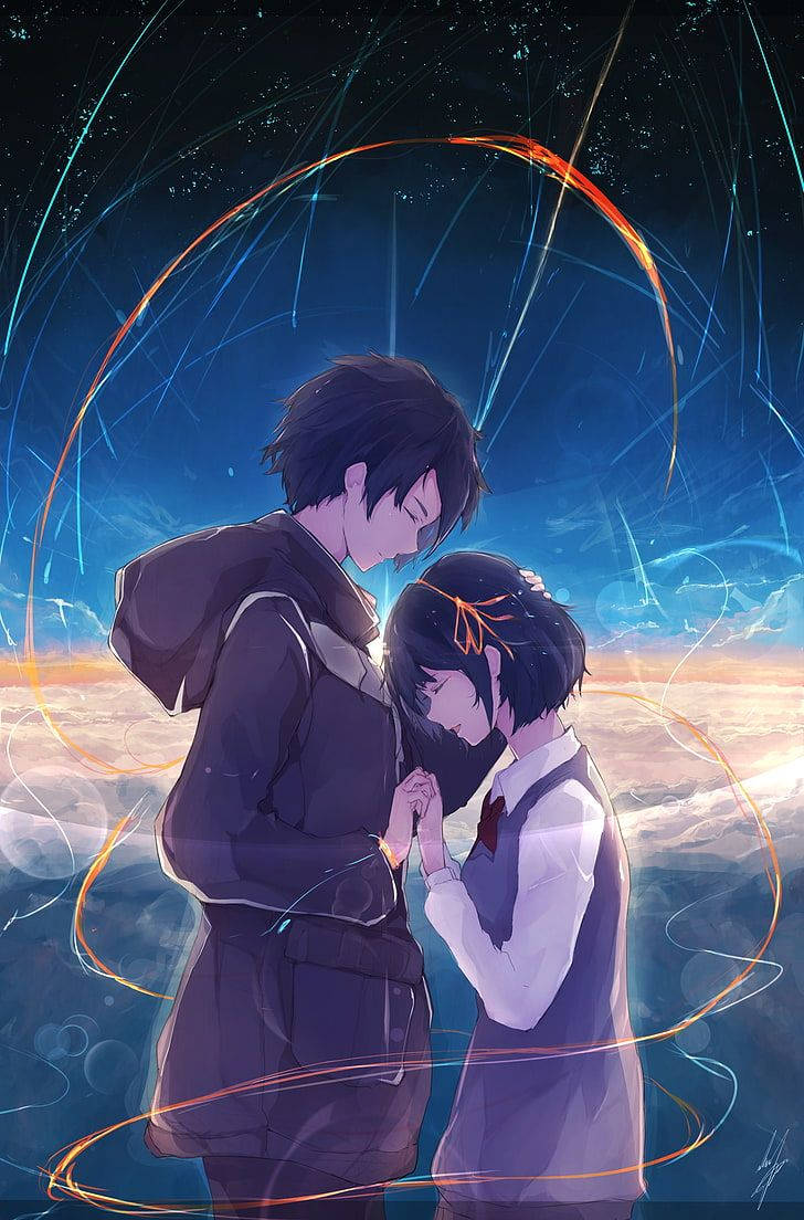 kimi no na wa phone 桌布 壁紙 — 兩個動漫青少年在星空下分享溫馨時刻，發光的橙色和藍色能量軌跡在他們周圍旋轉。