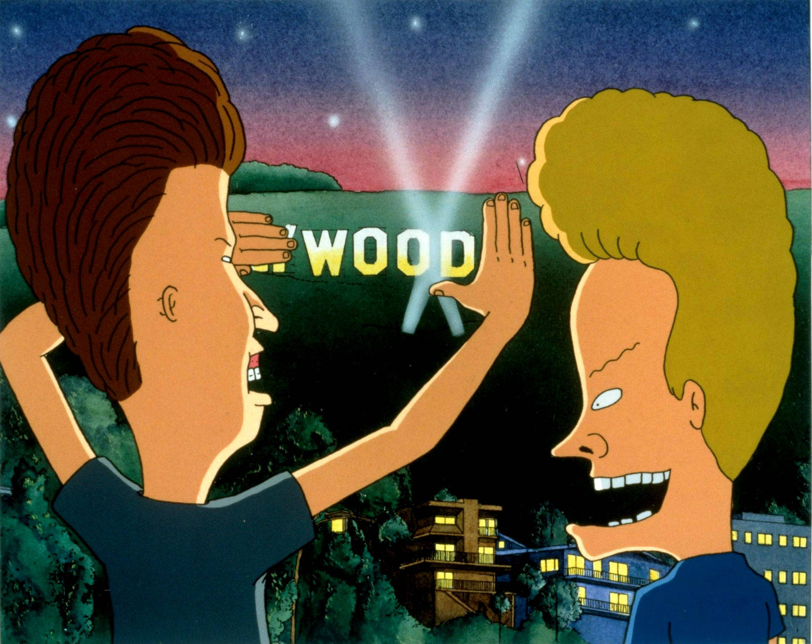 Beavis 桌布 壁紙 — 兩個動畫角色在黃昏時於好萊塢標誌的光束下擊掌，下方是城市燈光。