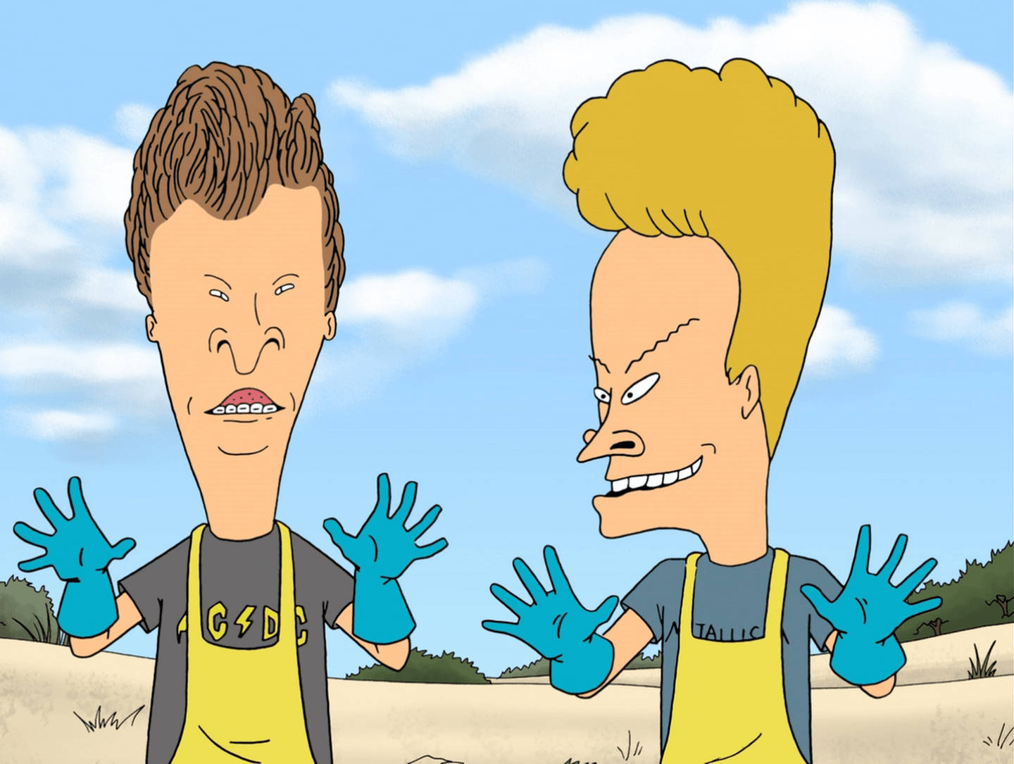 Beavis 桌布 壁紙 — 兩個卡通人物，特徵誇張，戴著藍色手套，站在沙漠中，天空蔚藍有雲。