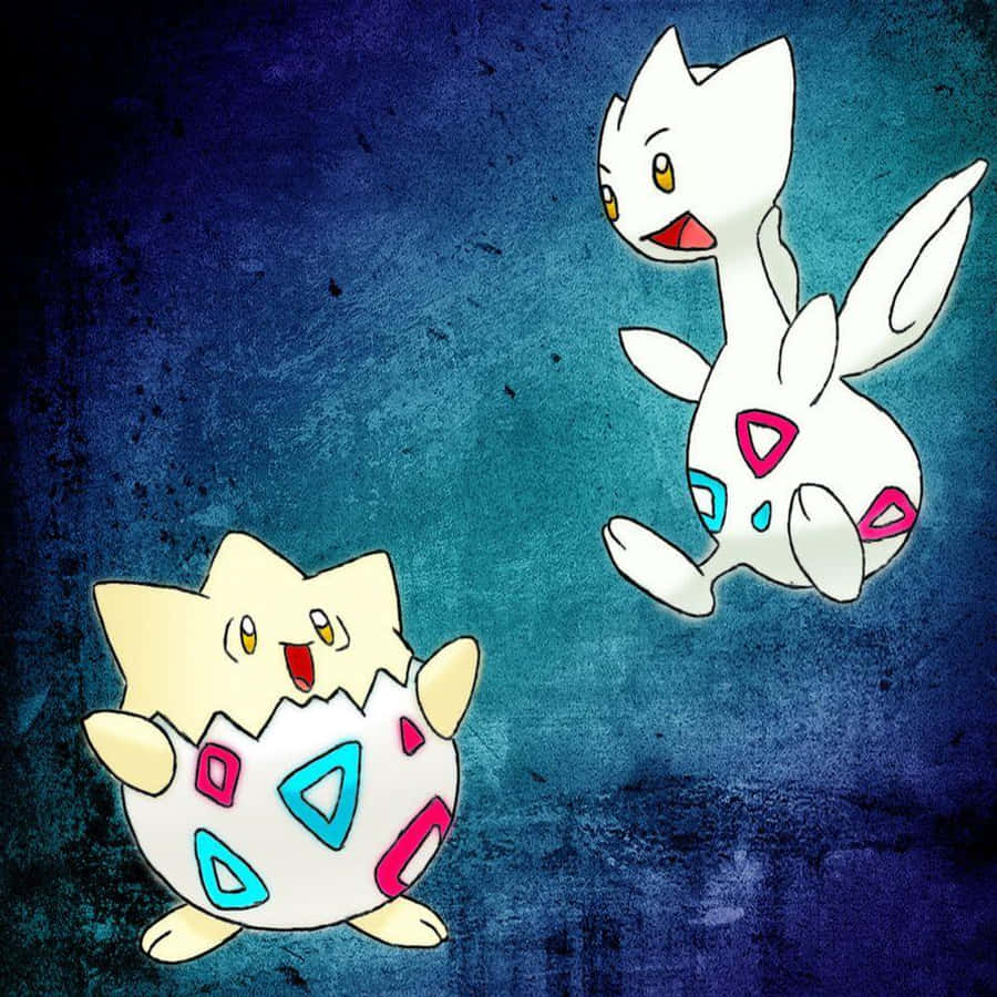 Pokemon Aesthetic 桌布 壁紙 — 兩個寶可夢角色，一個從蛋中孵化，另一個漂浮在旁邊，背景為紋理藍色。