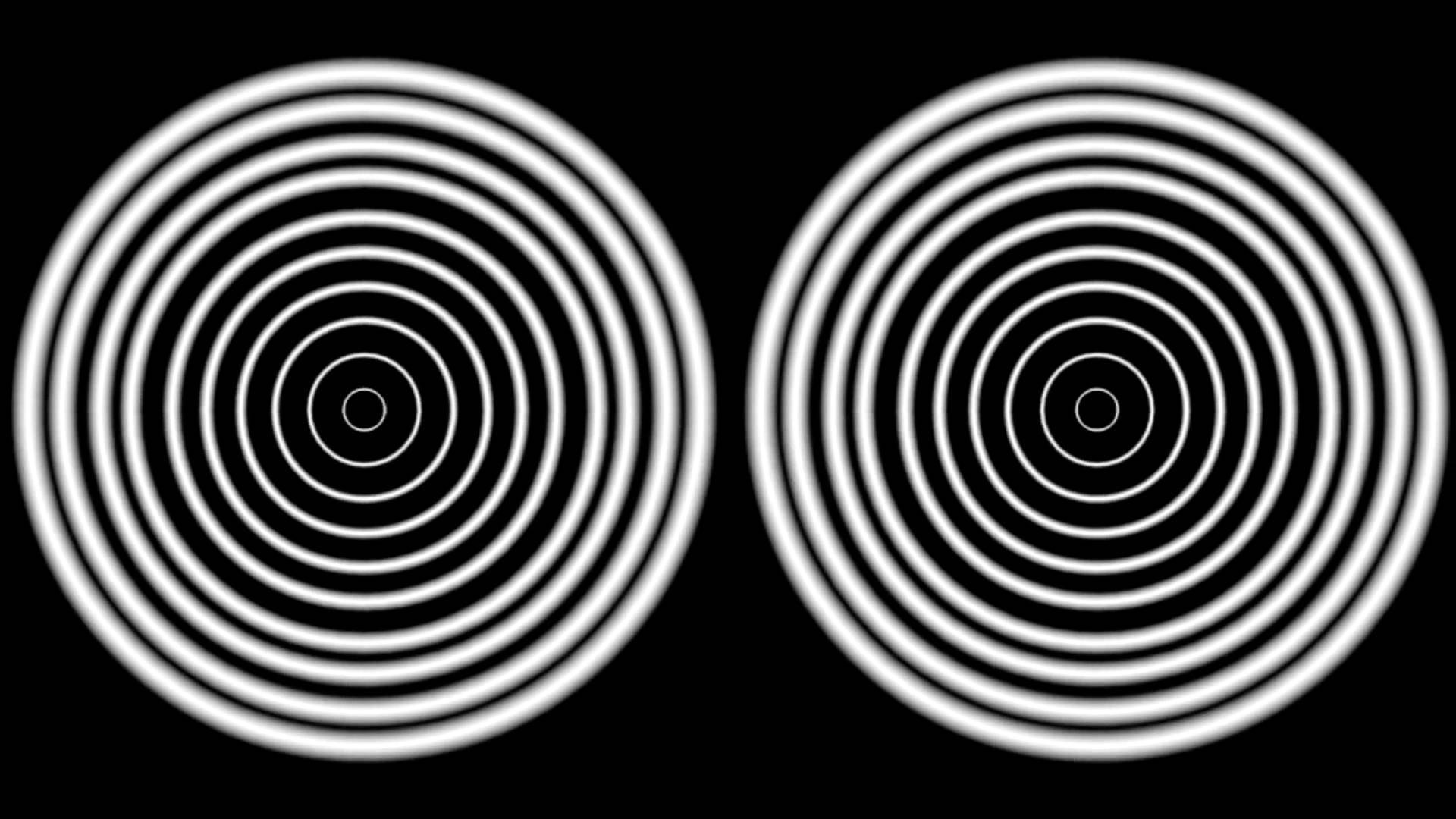 Hypnosis 桌布 壁紙 — 兩個對稱的白色同心圓圖案在純黑背景上向外輻射，營造出催眠般的視錯覺。