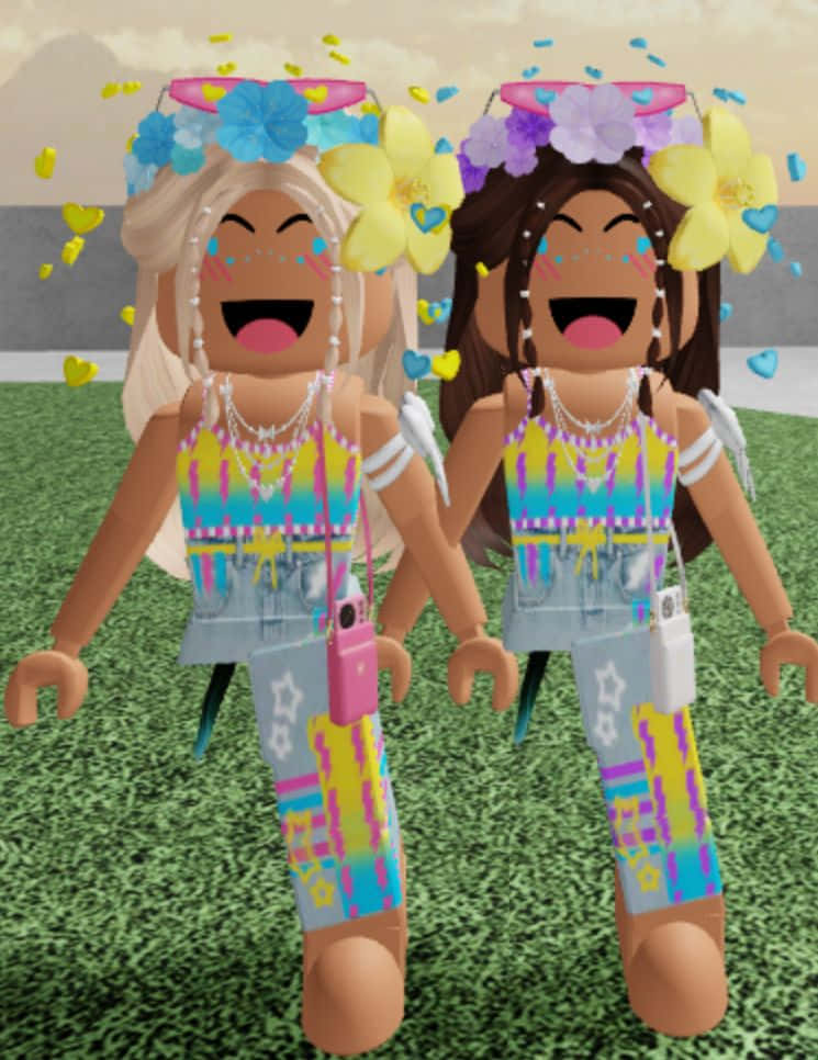 Roblox Aesthetic 桌布 壁紙 — 兩個快樂的Roblox頭像，戴著花冠和心形紙屑，在柔和的天空下的草地上慶祝。