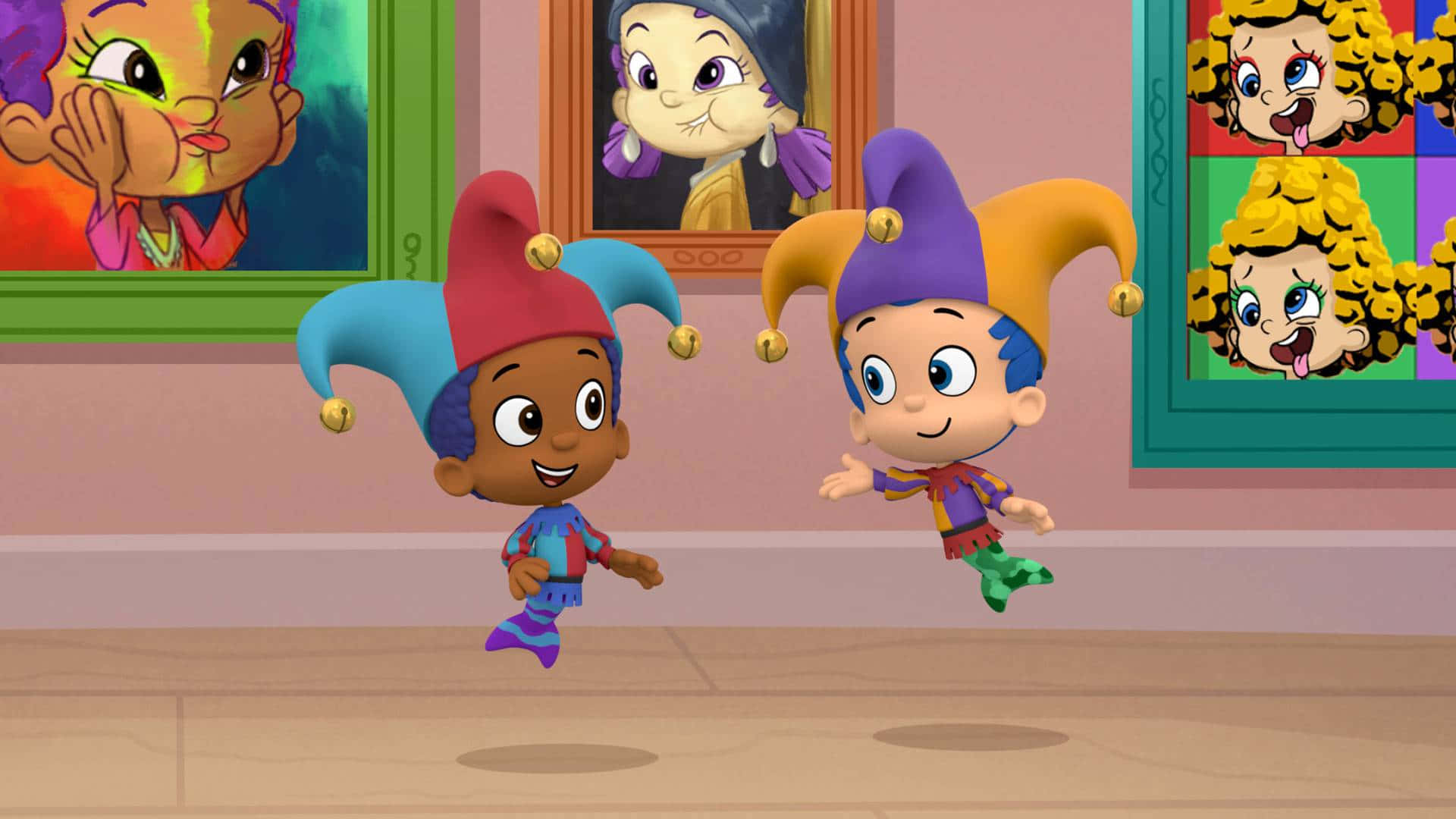Bubble Guppies 桌布 壁紙 — 兩個快樂的卡通小丑孩子在一個牆上掛滿彩色裱框肖像的房間裡歡快地跳躍。
