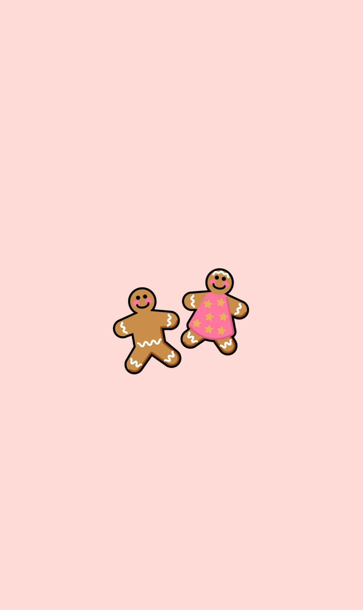 Cute Christmas Phone 桌布 壁紙 — 兩個快樂的卡通薑餅人，其中一個穿著粉紅色裙子，站在柔和的粉紅色背景前。