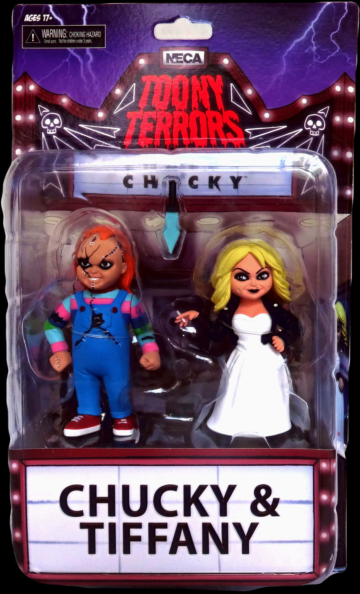 Toy 桌布 壁紙 — 兩個恐怖娃娃 Chucky 和 Tiffany 在它們的動作人偶包裝中，背景是鬧鬼的劇院。