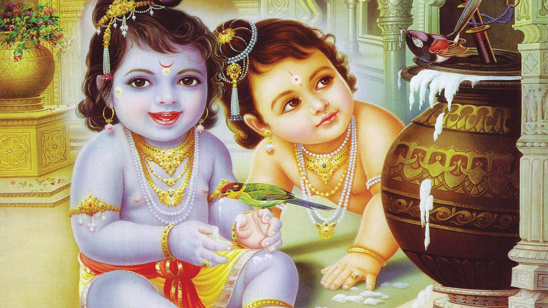 radha krishna HD 桌布 壁紙 — 兩個戴著金飾的神聖兒童形象坐在一個裝飾華麗的壺旁邊，手上棲著一隻鳥，身處寺廟環境中。