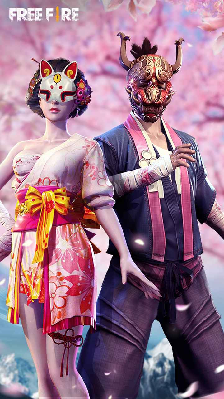 Free Fire Dj Alok 桌布 壁紙 — 兩個戴著面具的角色穿著鮮豔的日式風格服裝，站在飄落的櫻花中，背景是柔和的粉紅色天空。