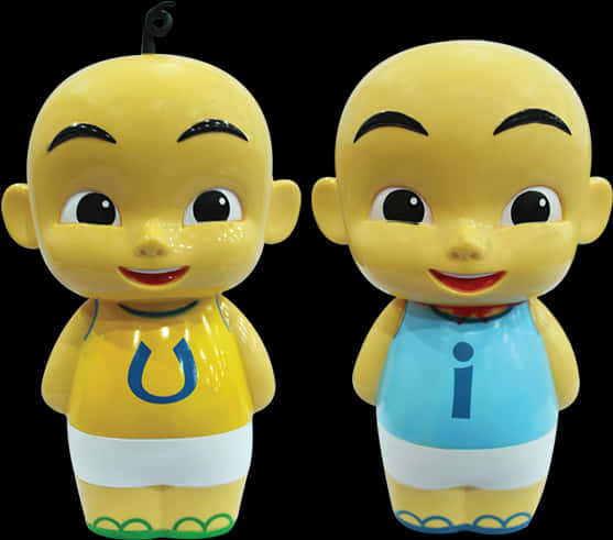 Upin Ipin 桌布 壁紙 — 兩個有光澤的黃色卡通公仔，大眼睛和笑容，穿著運動球衣，背景為黑色。