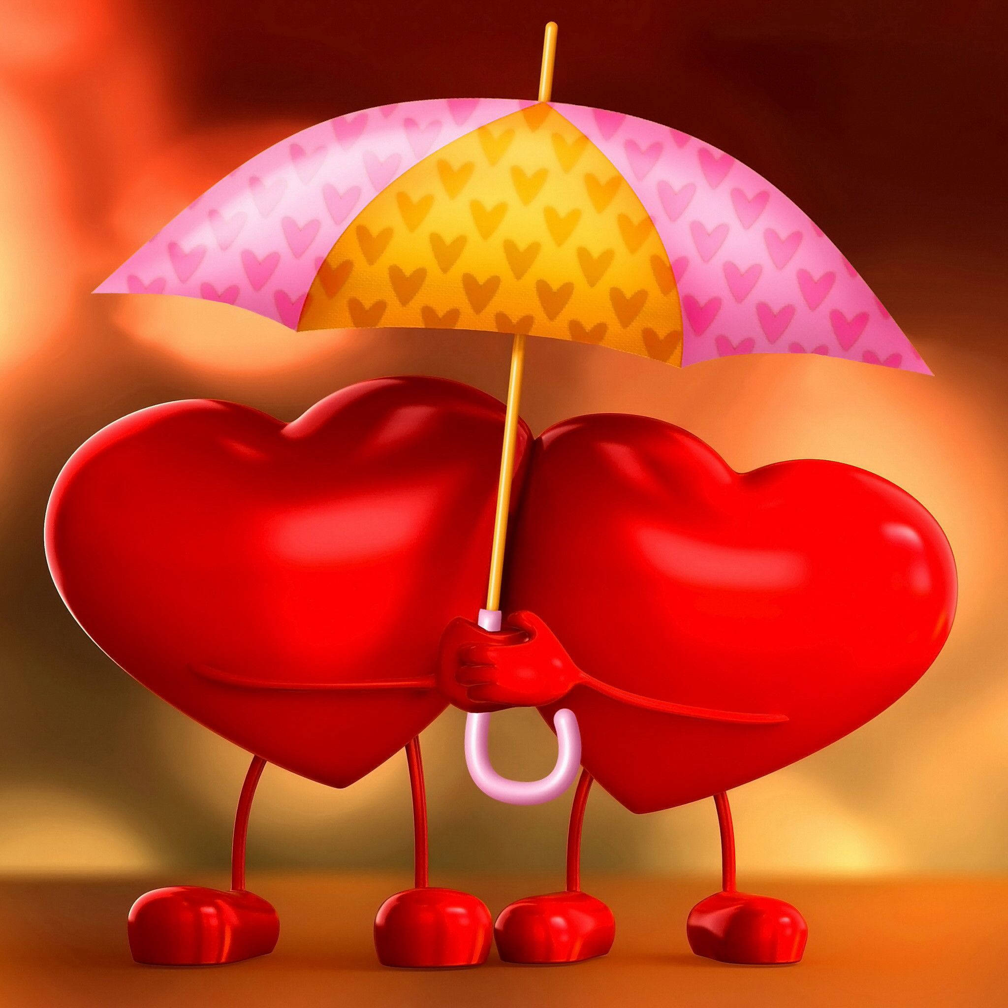 Love Heart 桌布 壁紙 — 兩個有腿的亮紅色心形角色，在溫暖發光的背景下，撐著一把粉紅和黃色心形圖案的雨傘。