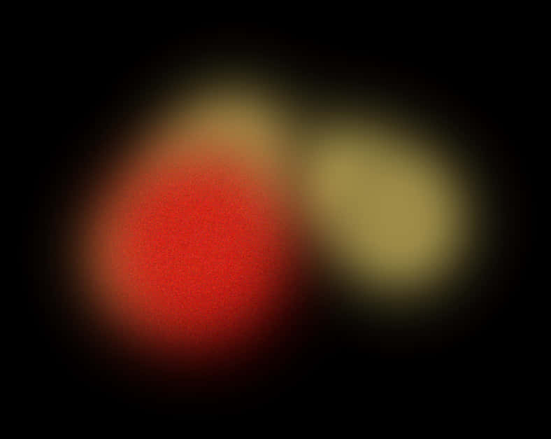 glow 桌布 壁紙 — 兩個柔和模糊的發光球體，一個紅色一個黃色，漂浮在深黑色背景上。