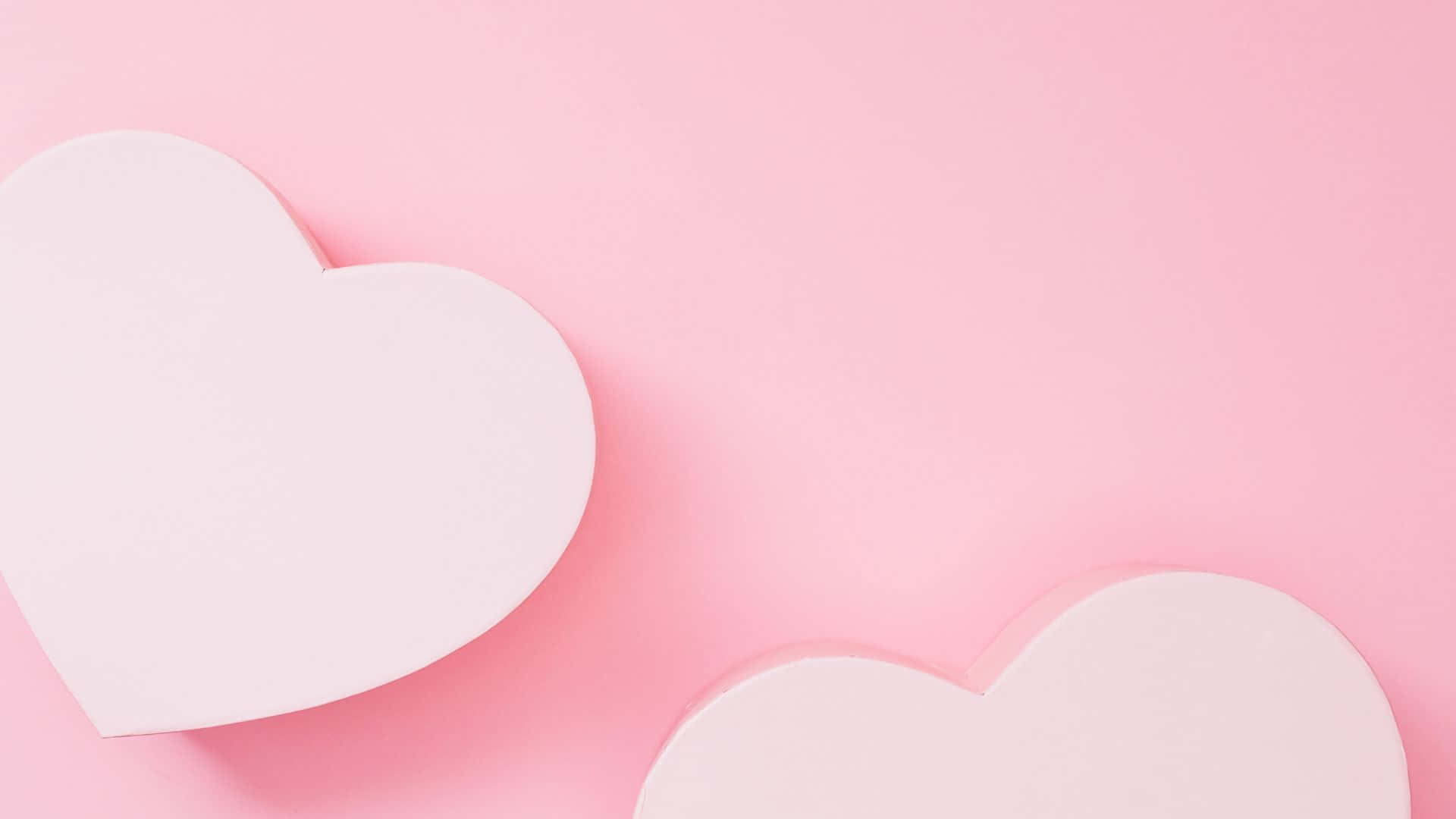 Pink Love 桌布 壁紙 — 兩個極簡白色心形圖案柔和地放置在粉紅色背景上，帶有輕柔陰影。
