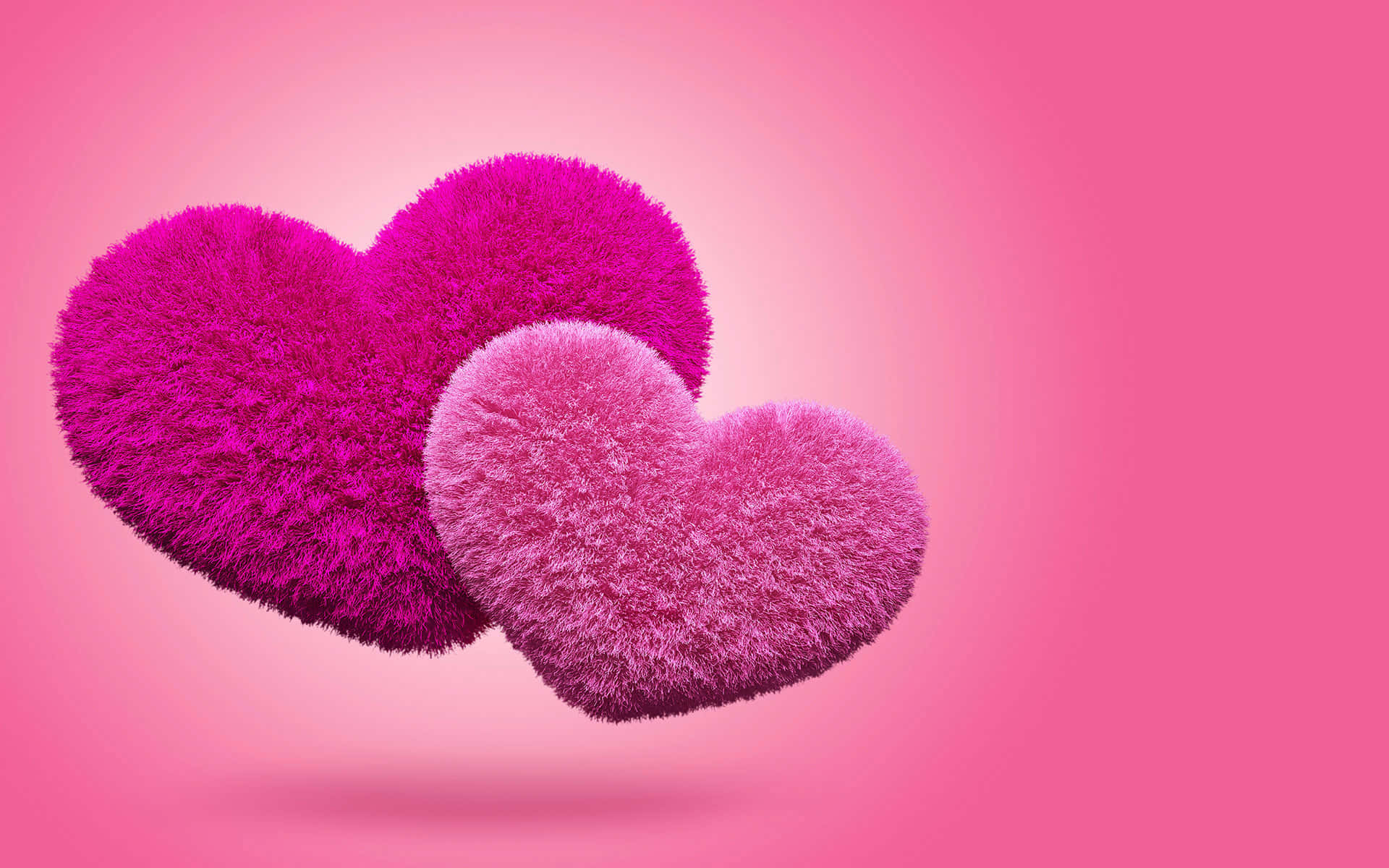 3d Heart 桌布 壁紙 — 兩個毛絨絨的立體心形在鮮豔粉紅色中輕輕漂浮在柔和的漸變粉紅色背景上。