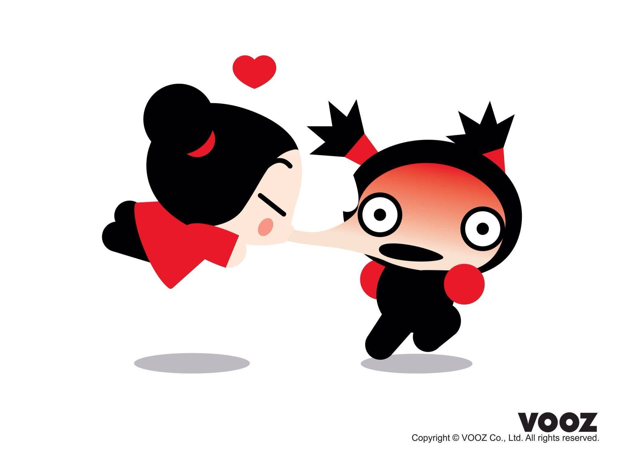 Pucca 桌布 壁紙 — 兩個穿著紅色和黑色服裝的卡通人物在一個漂浮的心形上方分享一個俏皮的吻。