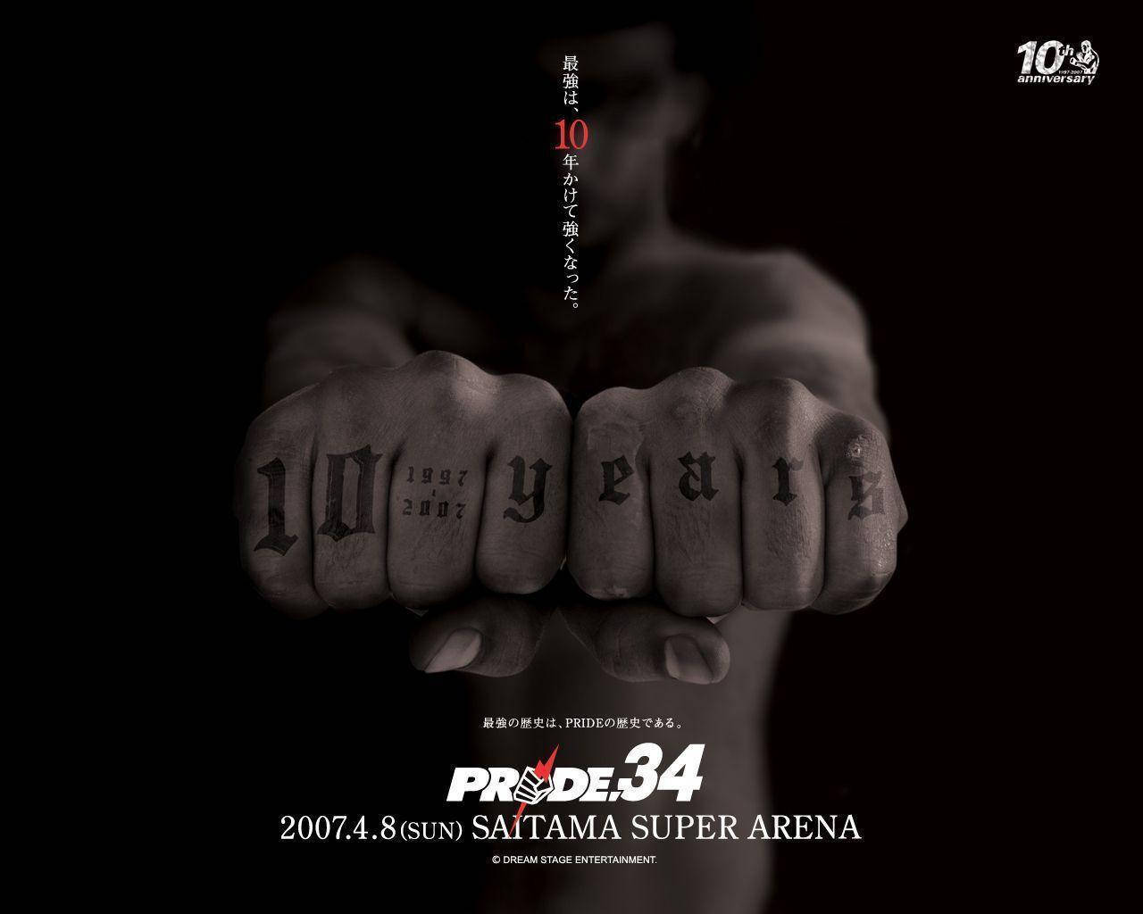 MMA 桌布 壁紙 — 兩個紋身拳頭在黑色背景上展示「10年」，附有日文文字和活動詳情。
