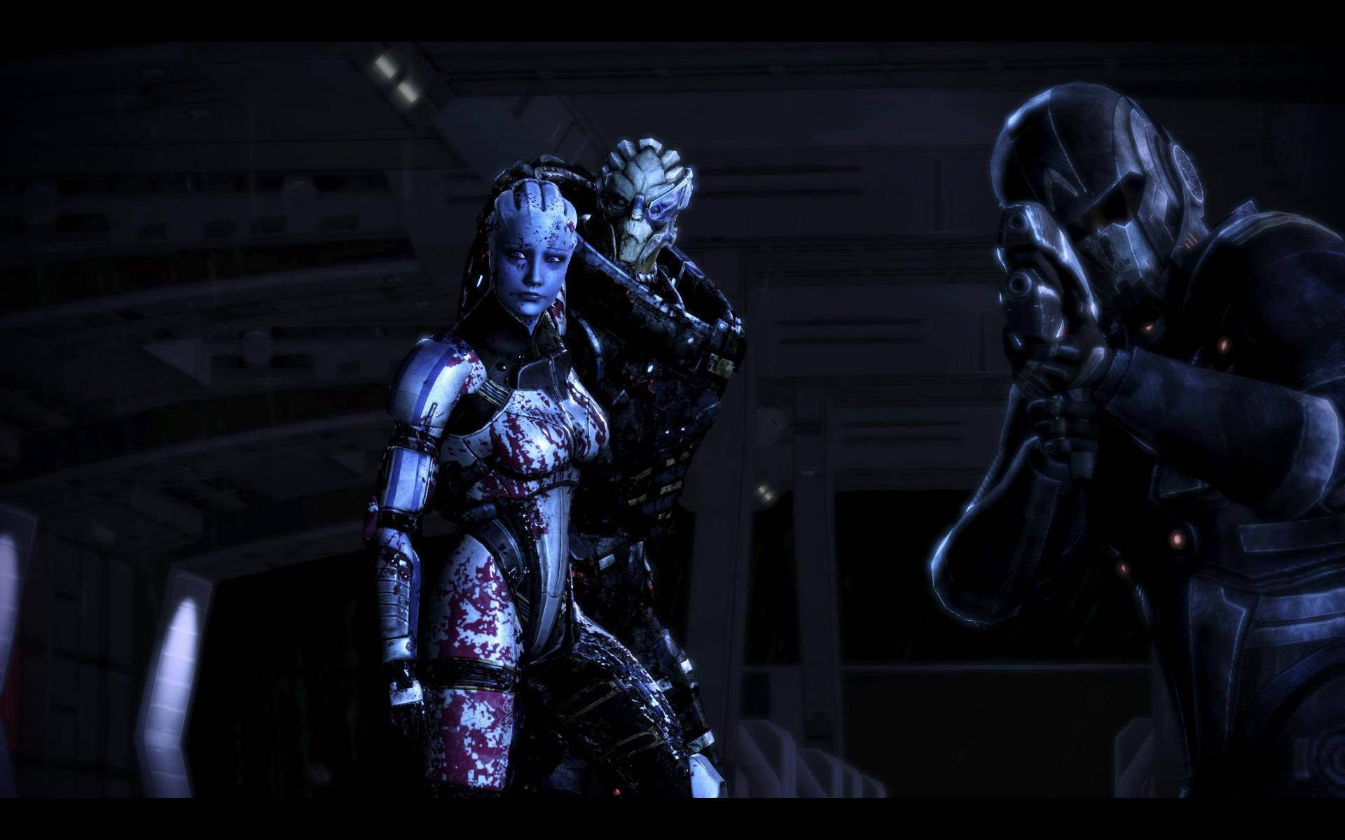 Mass Effect 3 桌布 壁紙 — 兩個裝甲機械人站在昏暗的未來風格走廊中，一個瞄準武器，另一個在冷藍燈光下保持警覺。