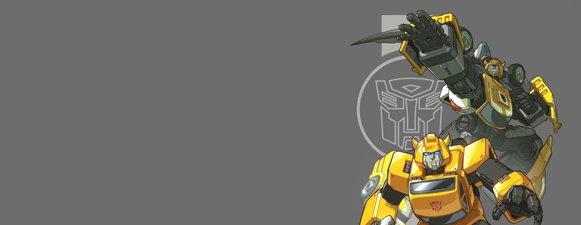 Cartoon Robot 桌布 壁紙 — 兩個變形金剛機器人，一個黃色一個深灰色，在純灰色背景前準備就緒，帶有Autobot標誌。