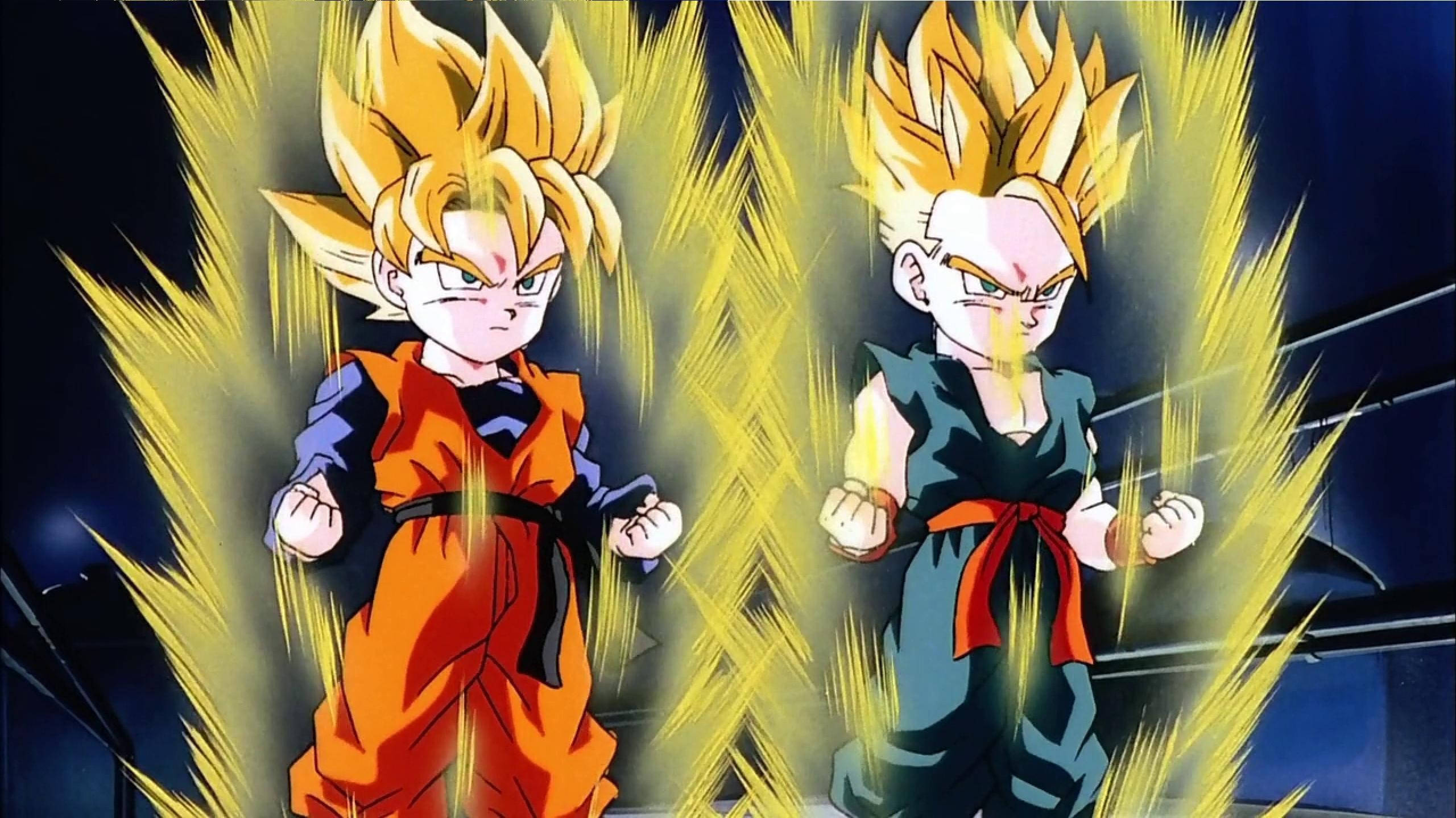Goten 桌布 壁紙 — 兩個超級賽亞人動畫角色在黑暗的競技場中閃耀著金色能量，握緊拳頭擺出戰鬥姿勢。