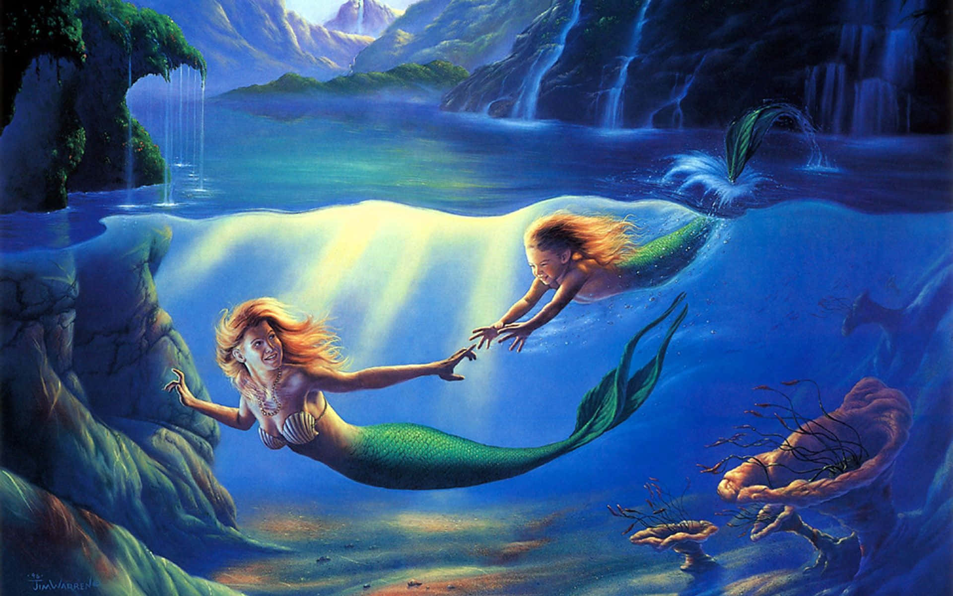 Real Mermaid 桌布 壁紙 — 兩個長髮飄逸的美人魚在發光瀑布和岩石懸崖附近的水底互相伸手觸碰。