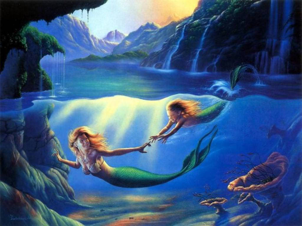 美人魚 桌布 壁紙 — 兩個長髮飄逸的美人魚在發光的陽光光束和瀑布附近的水下互相伸手觸碰。