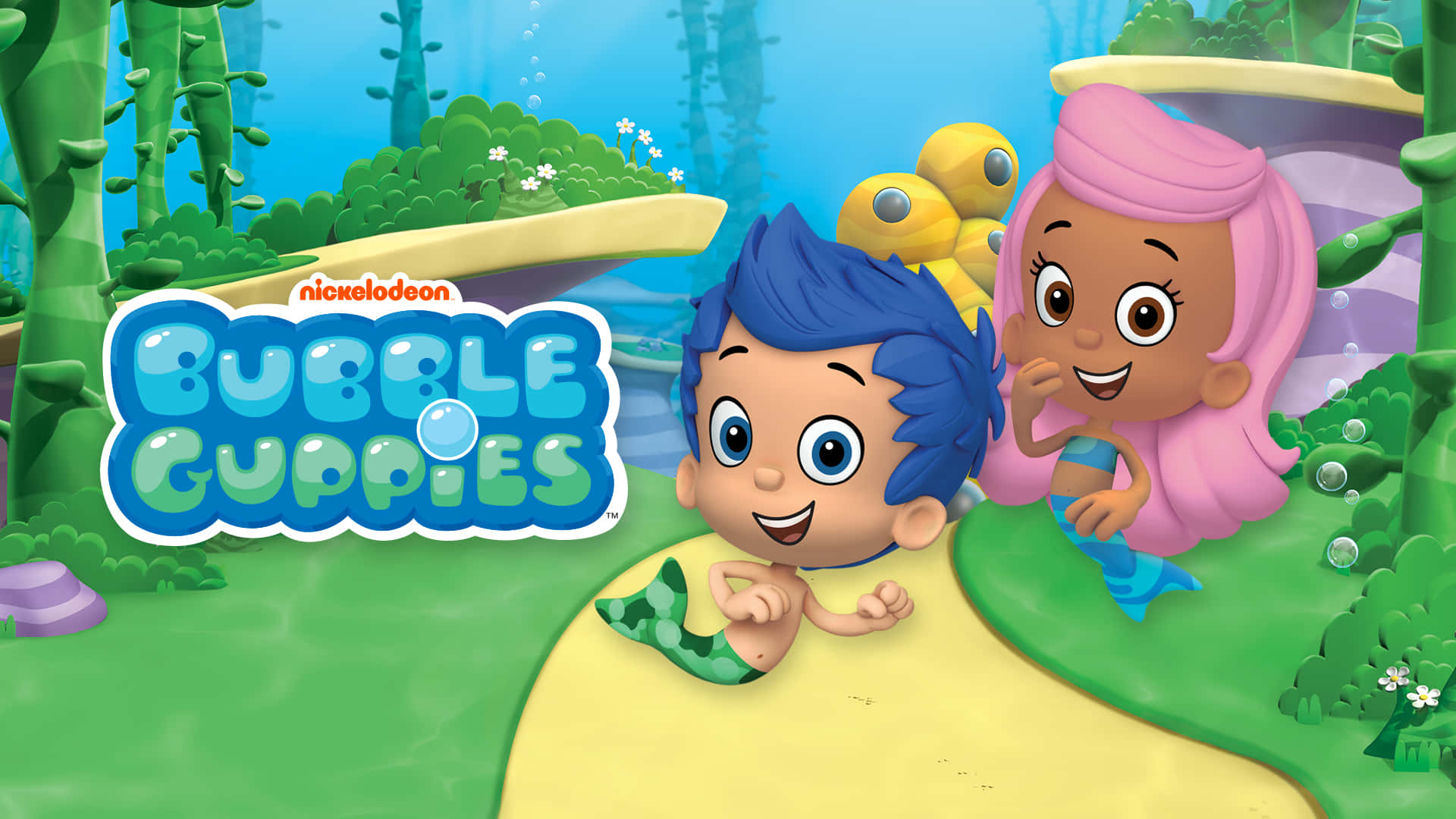 Bubble Guppies 桌布 壁紙 — 兩個開心的卡通美人魚小孩探索充滿珊瑚和氣泡的 vibrant 海底世界。