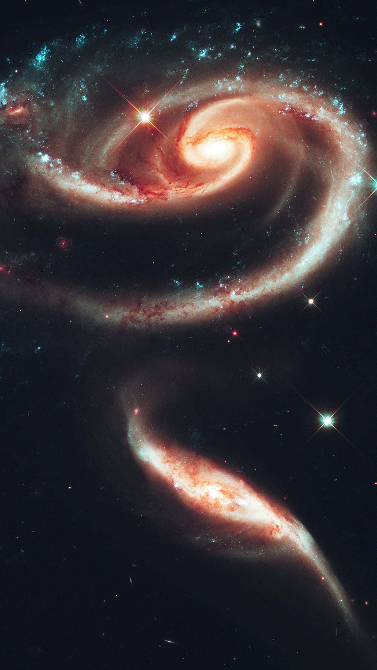 銀河 桌布 壁紙 — 兩個雄偉的螺旋星系在佈滿星星的天鵝絨黑色天空中旋轉起舞。
