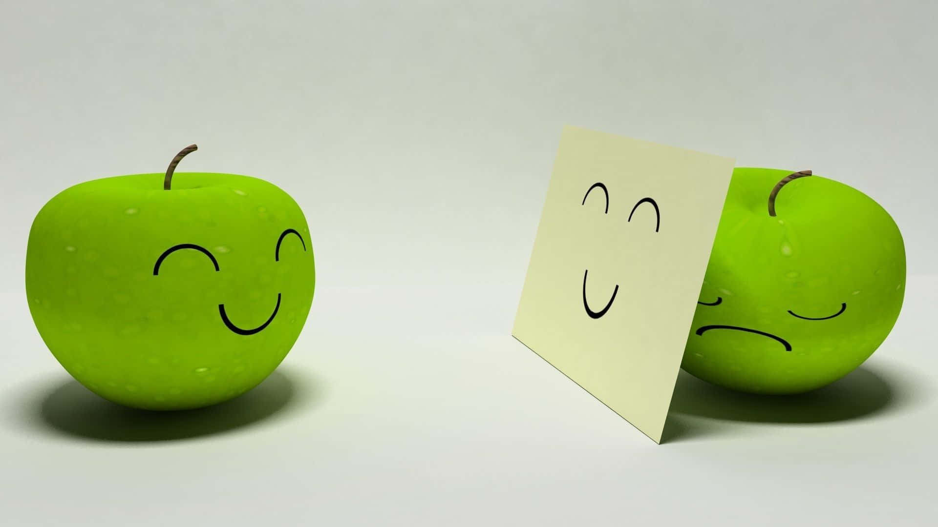Green Apple 桌布 壁紙 — 兩個青蘋果，一個微笑一個皺眉，中間有一張微笑的便利貼，在純白背景上。