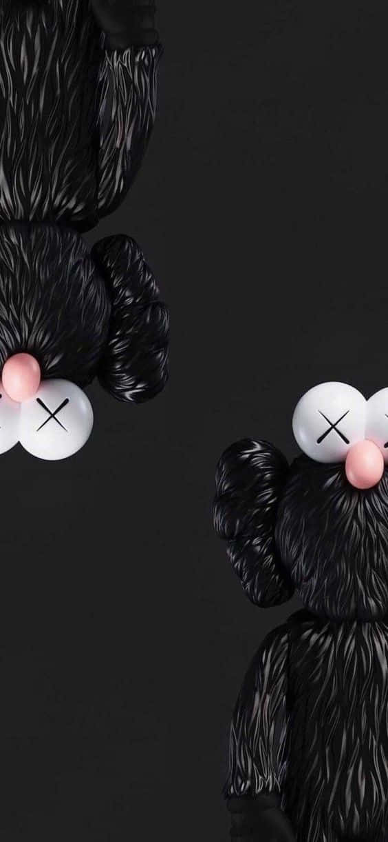 kaws pc 桌布 壁紙 — 兩個黑色KAWS熊公仔，有粉紅色鼻子和X形眼睛，站在深色背景前。