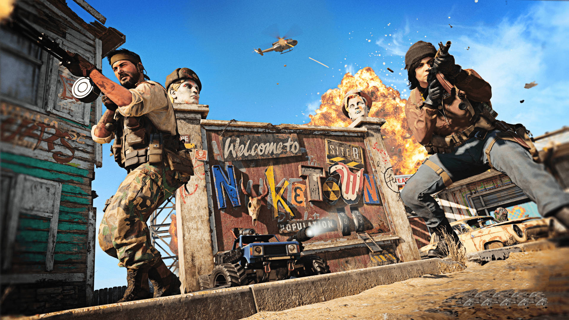 使命召喚 桌布 壁紙 — 兩名士兵在塵土飛揚的末日後小鎮中，在「Welcome to Nuketown」標誌附近爆炸中開火。