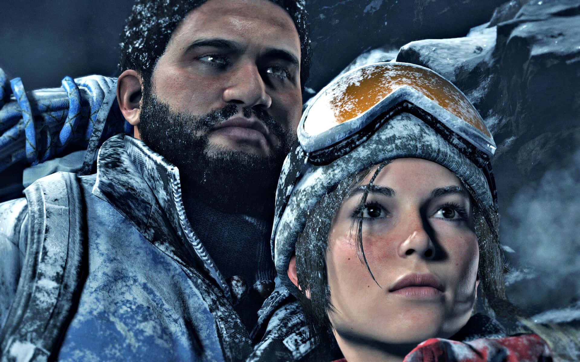 Rise Of The Tomb Raider 桌布 壁紙 — 兩名被雪覆蓋的冒險家，在寒冷的山區環境中，凝視著崎嶇的冰崖面。
