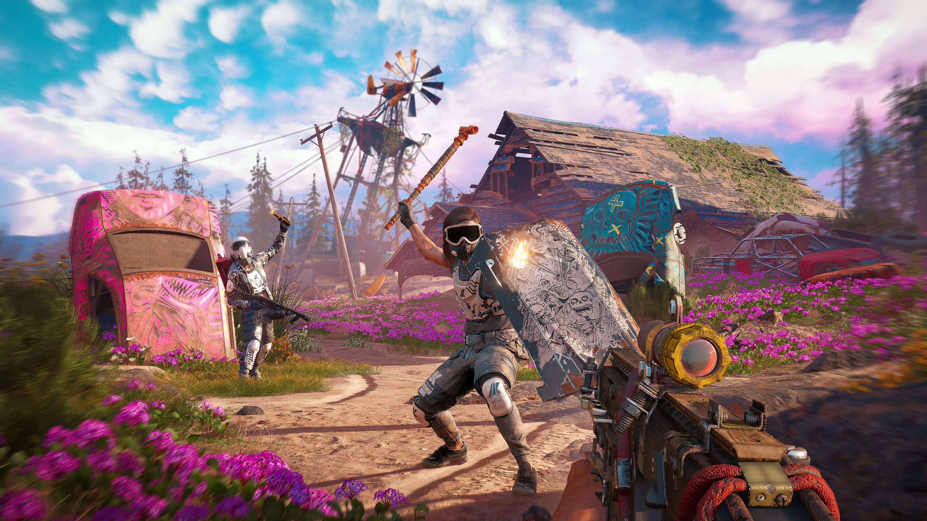 Best Far Cry 5 桌布 壁紙 — 兩名身穿盔甲的戰士在明亮天空下，於色彩繽紛的垃圾場附近一片充滿活力的紫色花田中戰鬥。