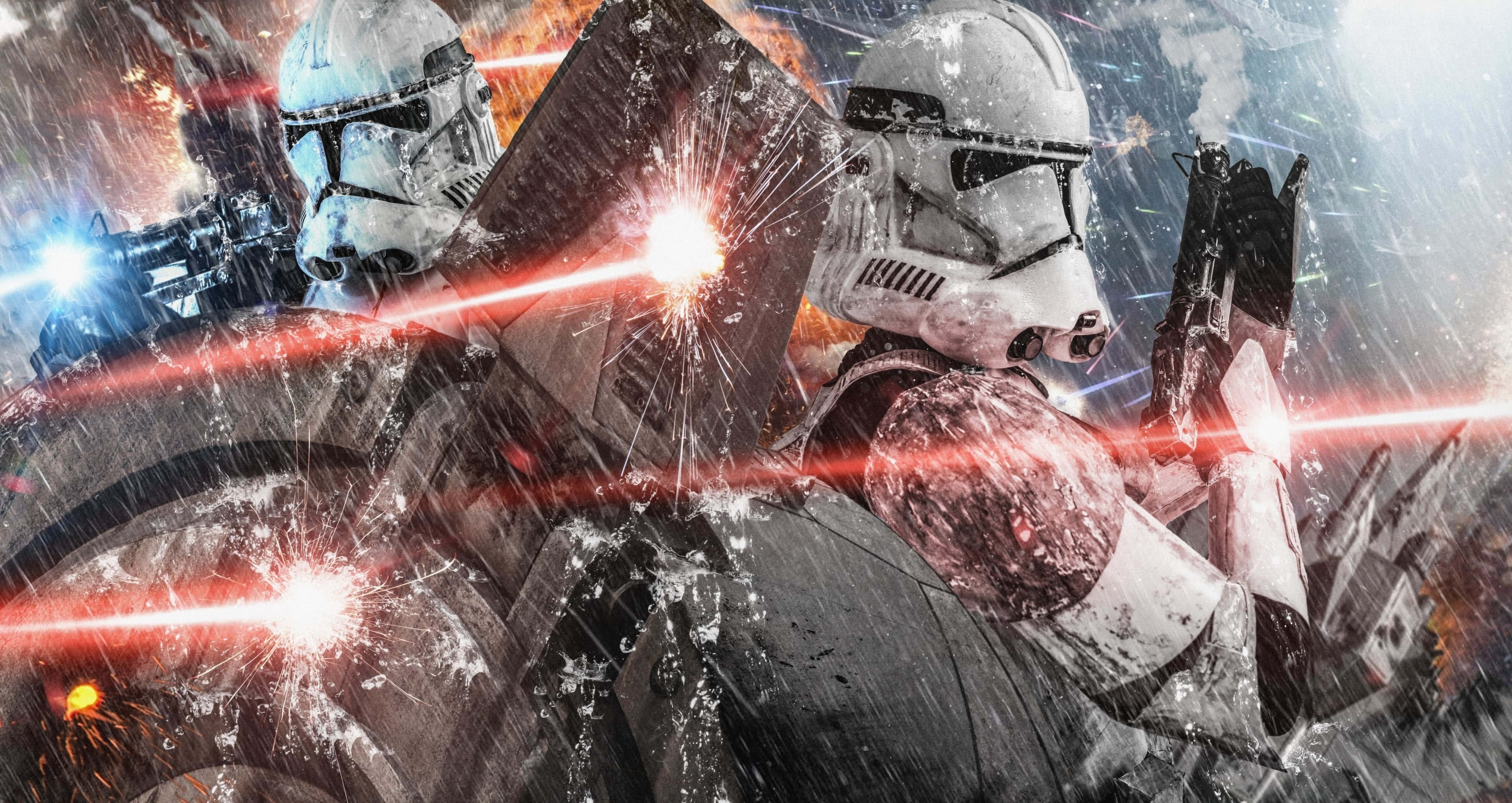 Clone Wars 桌布 壁紙 — 兩名風暴兵在雨水浸濕的戰場上戰鬥，紅色雷射爆炸在他們周圍爆發。