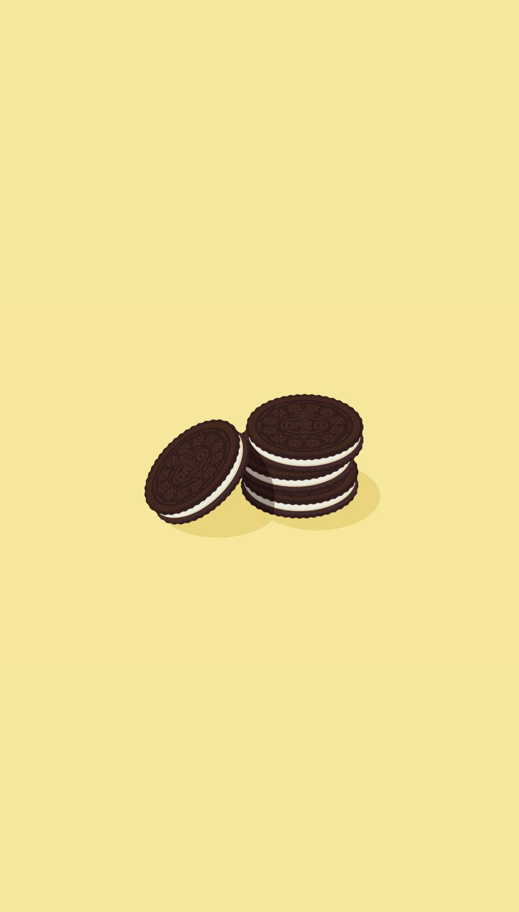Cookie 桌布 壁紙 — 兩堆帶有白色奶油餡的巧克力夾心餅乾放在淡黃色背景上。