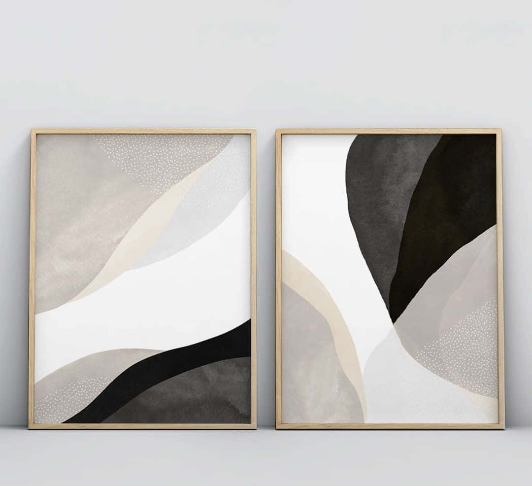 Modern Minimalist Art 桌布 壁紙 — 兩幅極簡抽象藝術印刷品裝在淺色木框中，並排掛在素牆上，呈現柔和曲線和單色調。