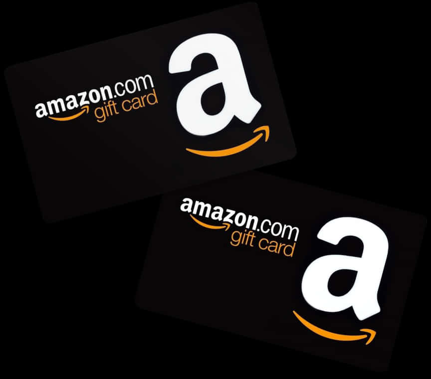 亞馬遜 桌布 壁紙 — 兩張黑色Amazon禮品卡，帶有白色和橙色標誌，對角放置在深色背景上。