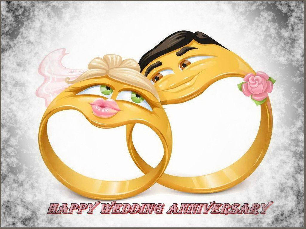 Happy Anniversary 桌布 壁紙 — 兩枚卡通風格的金色結婚戒指，帶有面孔和婚禮服飾，在雪景背景下分享一個充滿愛意的時刻。