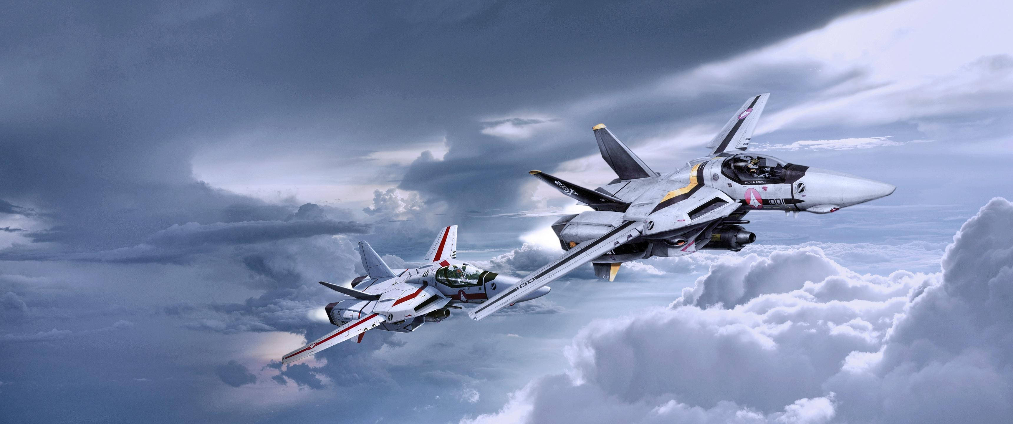 Macross 桌布 壁紙 — 兩架時尚的戰鬥機在暴風雲中翱翔，引擎在戲劇性的灰色天空下發光。