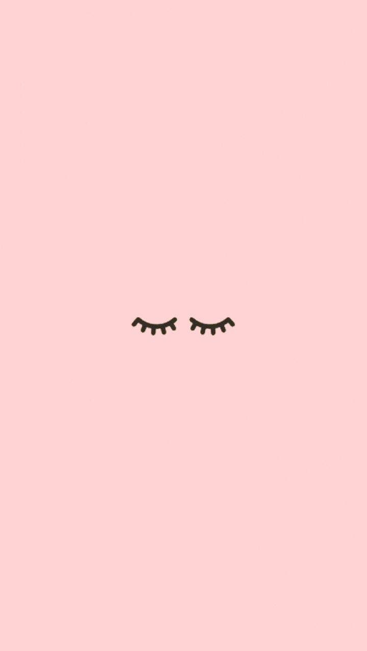 Cute Instagram 桌布 壁紙 — 兩條極簡黑色睫毛靜靜地躺在柔和的粉紅色背景上。