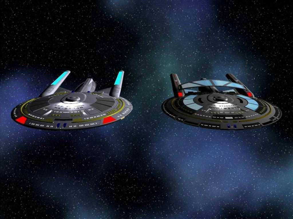 Starship 桌布 壁紙 — 兩艘星際艦隊的星艦在星空中滑行，星雲散發出深藍色和紫色的光芒。