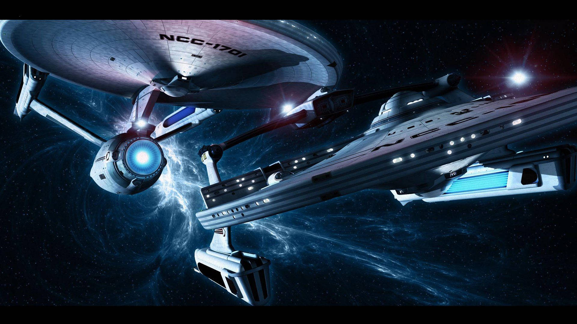星際爭霸戰 桌布 壁紙 — 兩艘星際艦隊飛船在充滿活力的星雲中滑行，配備發光的藍色引擎，背景是繁星點點的宇宙。
