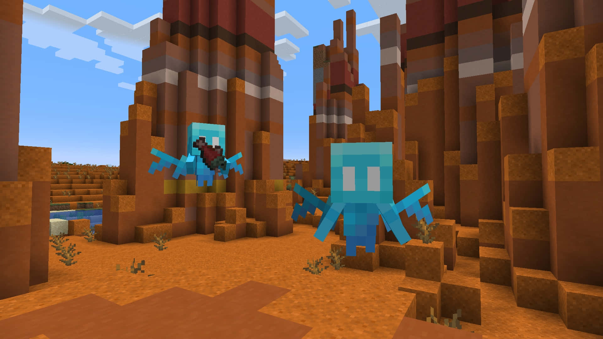 Minecraft Pocket Edition 桌布 壁紙 — 兩隻像素化的藍色蠑螈在沙漠峽谷中游動，周圍是方塊狀的岩石 formations，天空清澈湛藍。