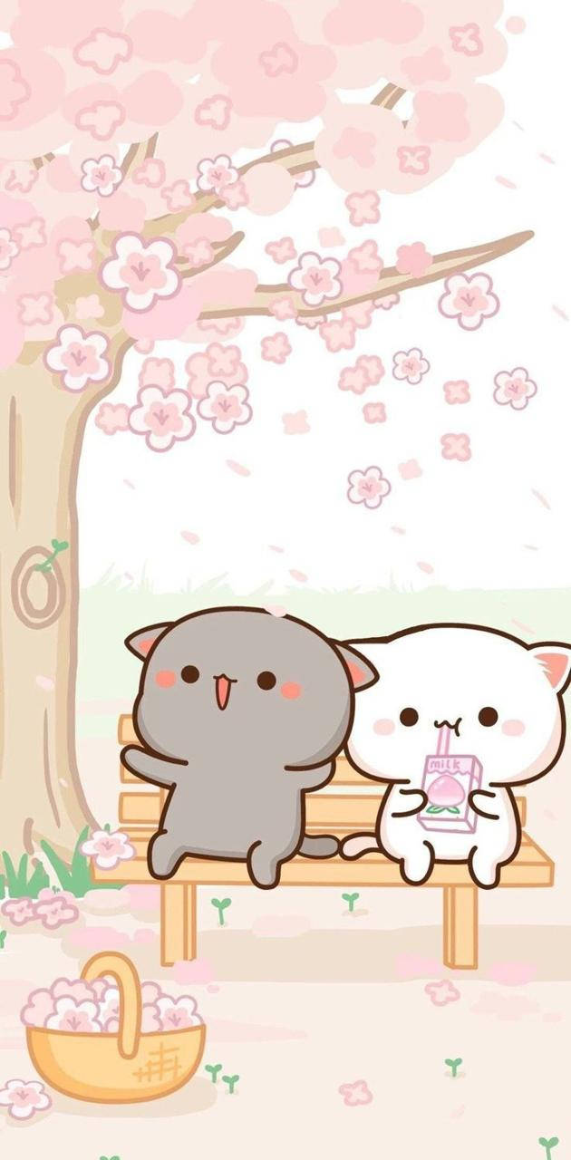 Cute Kawaii Cat 桌布 壁紙 — 兩隻可愛的卡通貓咪坐在長凳上，櫻花樹盛開，粉紅色的花瓣輕輕飄落在它們周圍。