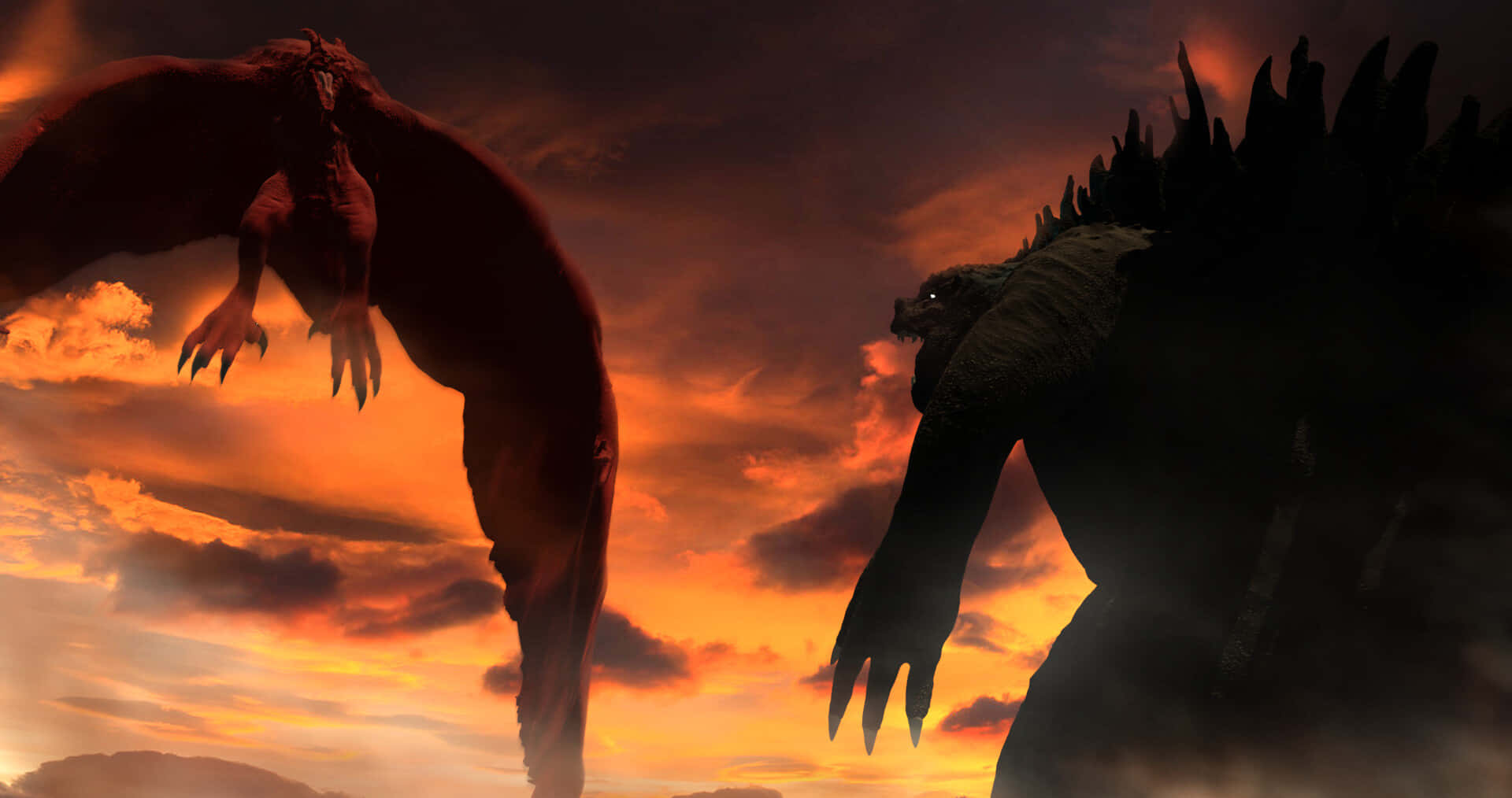Godzilla Vs Rodan 桌布 壁紙 — 兩隻巨大怪獸哥吉拉與王者基多拉在熾熱的橙紅色夕陽天空下對決。