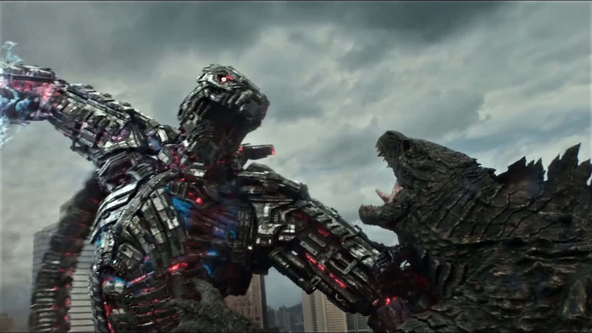 Godzilla Vs Mechagodzilla 桌布 壁紙 — 兩隻巨大的怪物在暴風雨天空下的廢墟城市中碰撞，一隻帶有發光紅色血管的機械改造體，另一隻原始而咆哮。