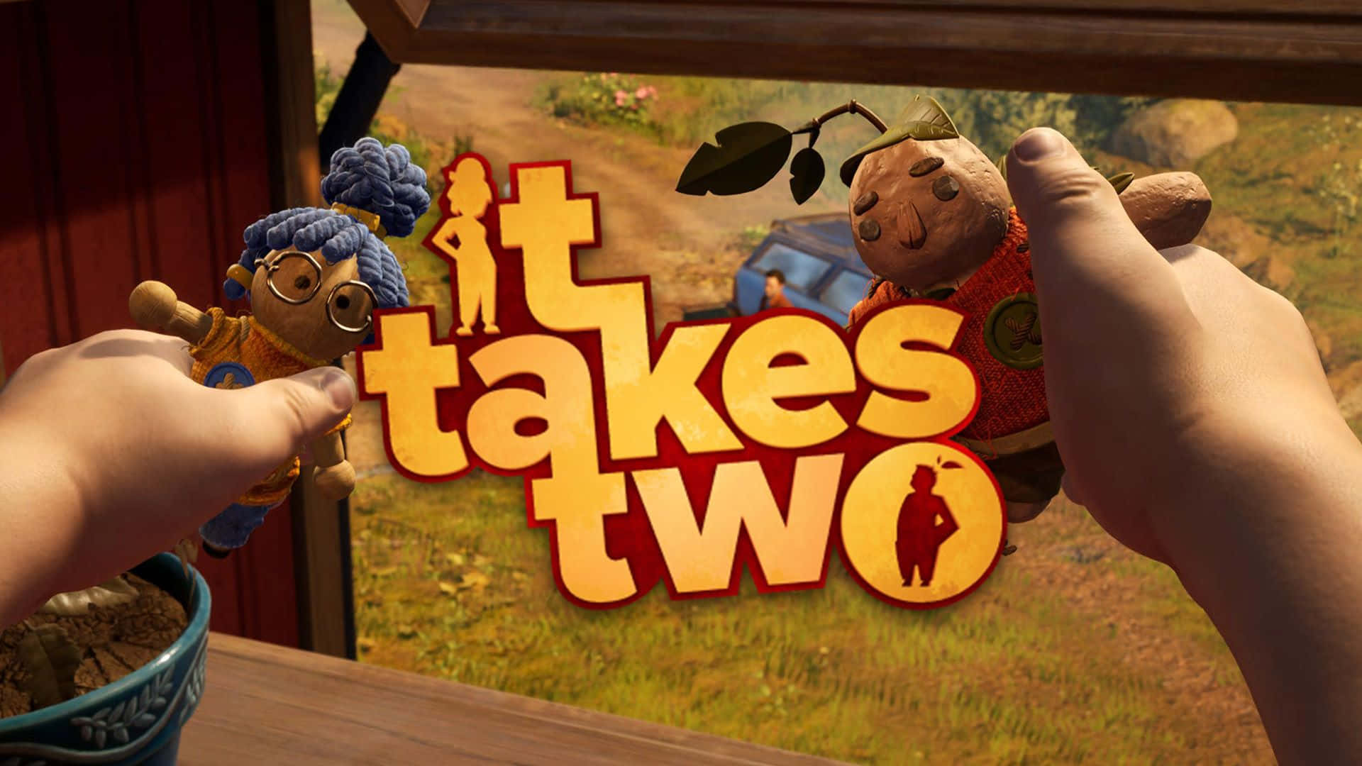 it takes two 桌布 壁紙 — 兩隻手在窗戶前抱著毛絨玩具，遊戲標題「It Takes Two」以粗體黃色字發光。