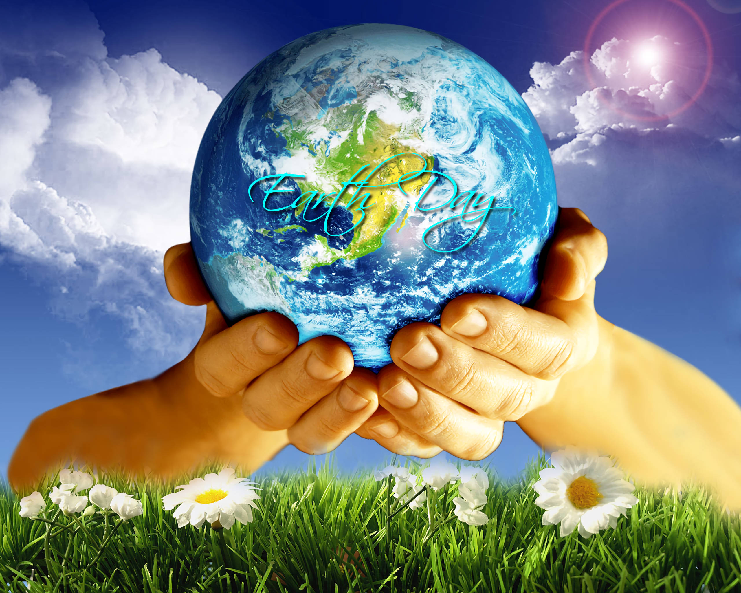 Earth Day 桌布 壁紙 — 兩隻手捧著一個發光的地球儀，在雛菊花田上方，藍天白雲下。